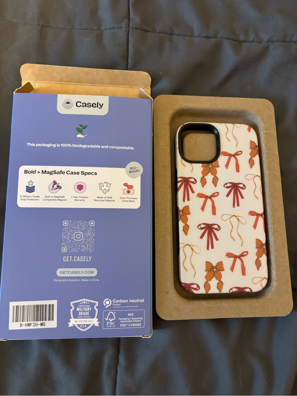 Casely White Phone Case with Orange Bow Pattern - MagSafe Compatible